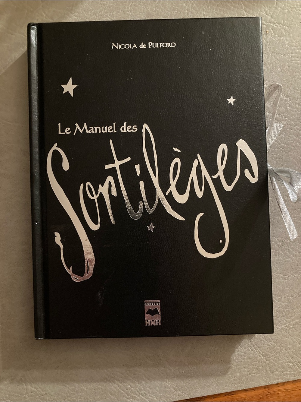 Le Manuel des Sortilèges Hardback Book in Black with Silver Lettering